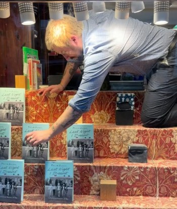 Taking the booksout of the window dispay to sell